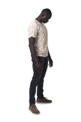 Naklejka premium side view of a man standing and looking down on white background