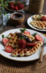 Close up waffles with topping strawberry