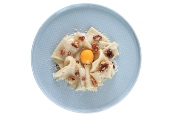 Isolated plate of Walnut alla Carbonara Pasta with sous vide poached egg
