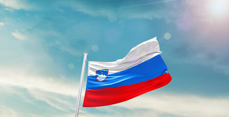 Slovenia national flag waving with beautiful sky.