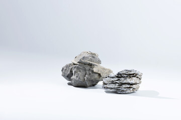 nature gray pebble stone gravel and grey boulder rock on desktop tabletop white clean background