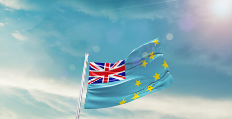 Tuvalu national flag waving with beautiful sky.