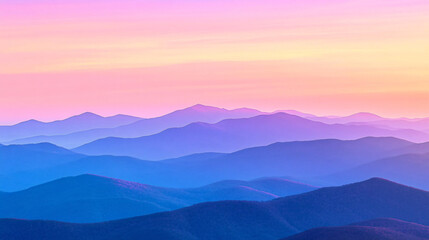 Dramatic scene of mountains silhouetted against a vibrant sunset sky full of colorful hues
