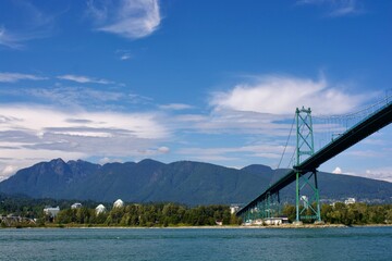 Lions Gate Bridge in front of Grouse Mountain at Stanley Park