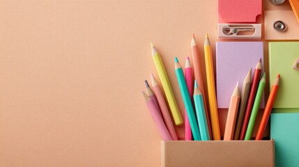 Fototapeta premium Colorful collection of art supplies arranged on a pastel background for creative projects or school activities