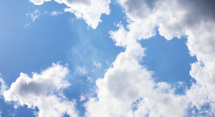 Dramatic form atmosphere of beautiful summer tropical blue sky and soft, fluffy clouds on shining and bright day. Image use for meteorology forecast background.