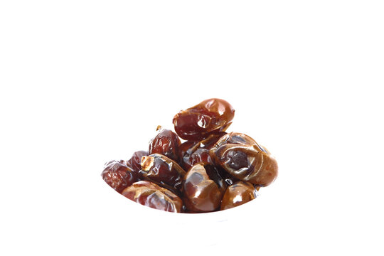 Ripe tamarind or Tamarindus indica fruit on white background