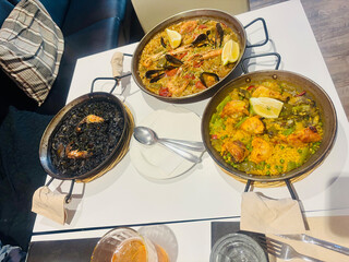 Traditional Spanish paella cooked in a large pan, served fresh in Barcelona