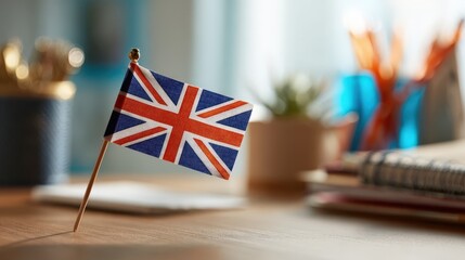 Small British Flag on Wooden Desk Study Background Learning English Concept