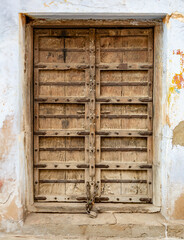 Close-Up of Old Weathered Wooden Door in Stone Wall, Pushkar, India