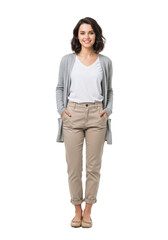 Fototapeta premium Young caucasian woman, late teens/early twenties, wavy dark brown hair, warm smile, white t-shirt, light grey cardigan, beige high-waisted pants, nude ballet flats, hands in pockets, against seamless