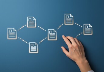 Hand interacting with digital document network on blue background