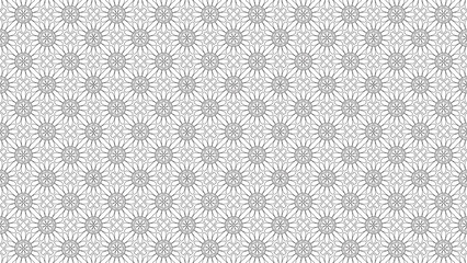 Detailed black and white floral pattern with symmetrical repeating flower designs throughout the image