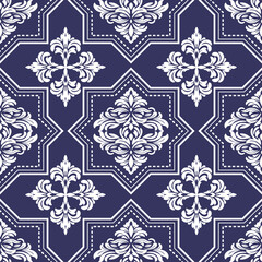 Ornate floral damask pattern in white on a deep navy blue background featuring repeating stylized motifs