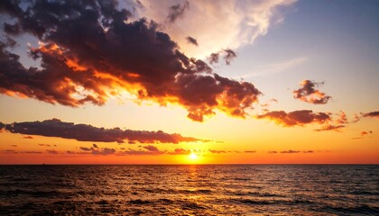 Fiery Sunset Over the Ocean with Dramatic Clouds and Golden Reflections