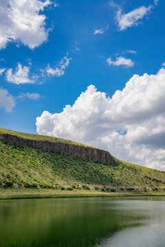 Nar Lake volcanic crater reflecting on the water surface in Turk
