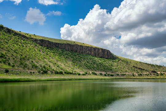 Nar Lake volcanic crater reflecting on the water surface in Turkey