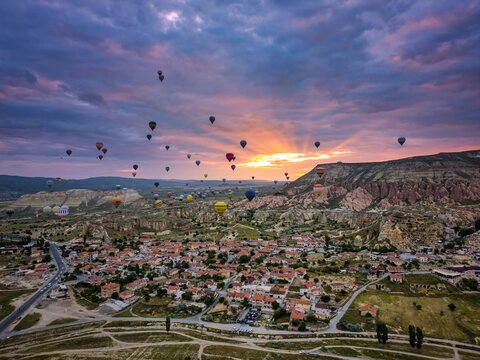 Drone aerial view of hot air balloons flying over Cappadocia in Turkey