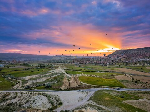 Drone aerial view of hot air balloons flying over Cappadocia in Turkey