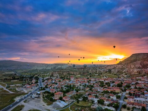 Drone aerial view of hot air balloons flying over Cappadocia in Turkey