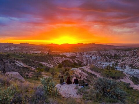 Friends enjoying a sunset view in Cappadocia's Red and Rose Valley