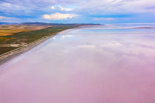 Drone capturing aerial view of pink Tuz Lake in Turkey