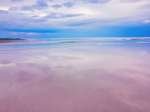 Drone capturing aerial view of pink Tuz Lake in Turkey