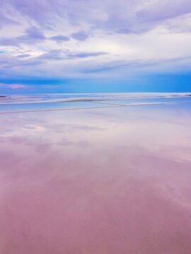 Drone capturing aerial view of pink Tuz Lake in Turkey