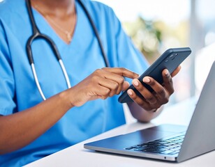 Laptop, healthcare and hands of nurse with phone for medical research, planning and schedule in hospital. Telehealth, communication and black woman with digital tech for online consultation in clinic.