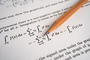 Pencil on mathematic formula exercise test paper in education school.