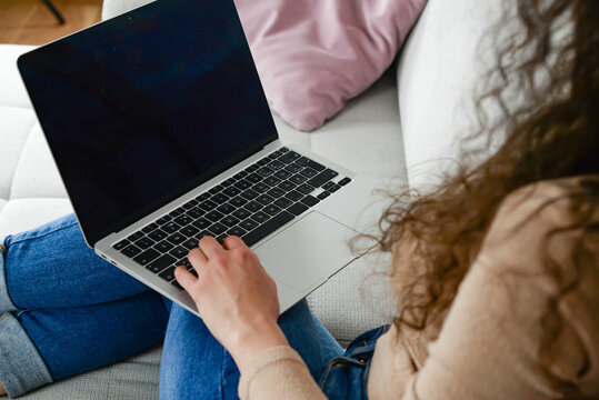 Female hands with laptop close-up, concept of remote work.education and business