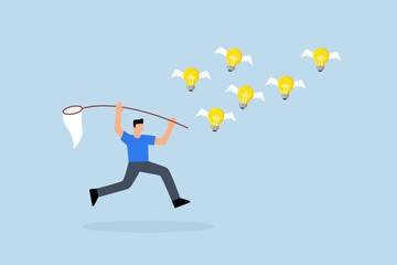 Capture new business ideas, businessman hunts and catches ideas to fly light bulbs with butterfly net.