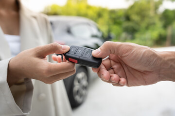 lease, rental car, sell, buy. Dealership manager send car keys to the new owner.  Sales, loan credit financial, rent vehicle, insurance,  renting, Seller, dealer, installment, car care business