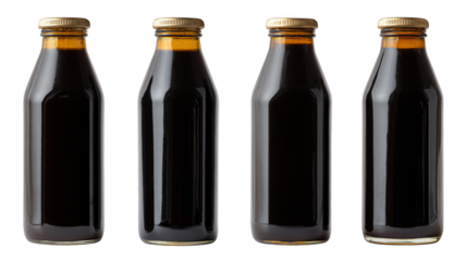 Four Glass Bottles of Soy Sauce Isolated on White.