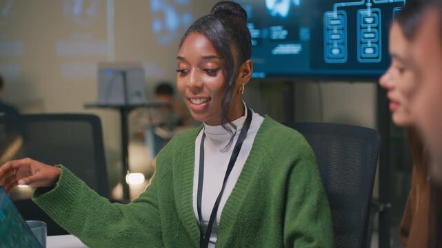 Business presentation on software development innovation, led by thoughtful woman discussing advanced ai and machine learning technology with her colleagues - Powered by Adobe