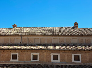 ancient brick building in contrast with the blue sky