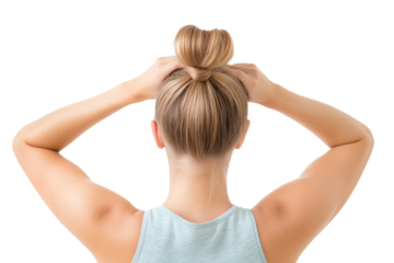 Woman with blonde hair styling a bun, showcasing an active and casual lifestyle, with a focus on personal grooming.