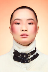 Young Asian woman with chic fashion and soft makeup.