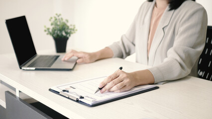 Businesswoman employer holding resume, recruiting, planning, evaluating and reviewing resume of job applicant, recruiting new employees, recruitment concept