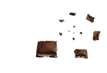 Pieces of dark chocolate swirl exploding and swirling in mid-air against a clean transparent background. Dynamic and delicious