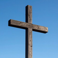 Simple wooden cross against a clear sky