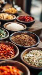 Fototapeta premium Aromatic assortment of exotic spices and dried herbs in rustic ceramic bowls, a journey for the senses.