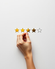 Hand Placing Star Rating on White Background for Feedback or Review Concepts