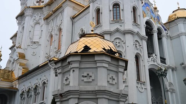 The scars of war on a sacred landmark in Kharkiv, Ukraine. This close-up shows shrapnel damage to the Holy Myrrh-Bearing Women Church after a Russian attack.