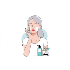 Fototapeta premium Applying facial cream after cleansing for skincare routine, woman applies gentle facial cream to moisturize her face.