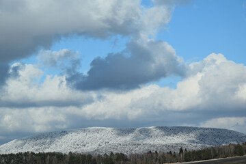 Landscape scenery blue sky, and hilltops in spring with little snow