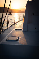 Sailboat on the sea by sunset