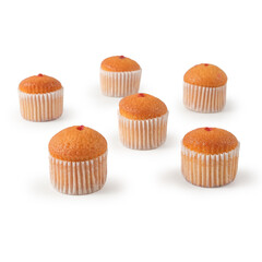 Flat lay of several small cupcakes in white baking cups placed on a clean white background. Ideal...