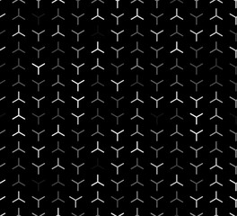 A sleek grid of Y-shaped elements in shades of white and gray set against a black background. The high contrast and subtle gradient produce a modern, elegant, and visually compelling abstract design.