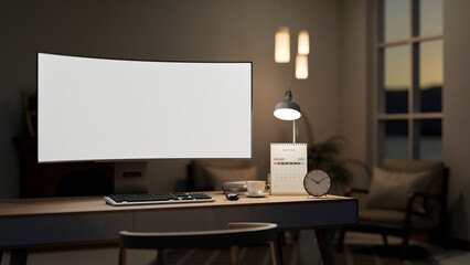 White curved screen computer with coffee, calendar under lamp light on wooden table in dim lit room.